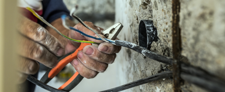 Man touching wires