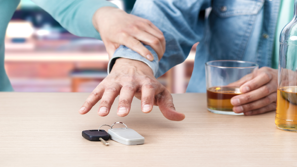 Man trying to grab car keys after drinking
