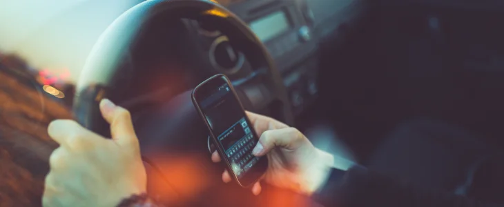 Man driving while on his phone, distracted driving